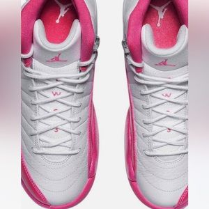 A brand new pair of pink and white Jordan’s never used ….